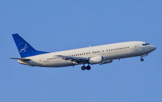 BOEING 737-400 (N313XA) - An IAero 737-400 landing at GSP viewed from Simpsonville, SC.  Definitely a treat to catch the 737 Classics!  1/15/2022.