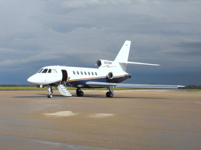 Dassault Falcon 50 (N358MH) - On the Million Air ramp after an afternoon thunderstorm. 