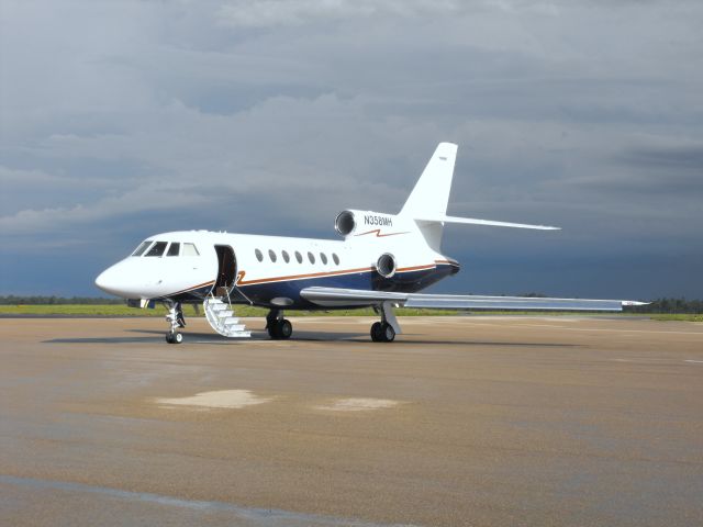 Dassault Falcon 50 (N358MH) - On the Million Air ramp after an afternoon thunderstorm. 