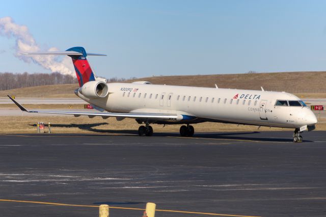 Canadair Regional Jet CRJ-900 (N300PQ) - Endeavor Air CRJ-900 sitting outside the Endeavor hangar at CVG