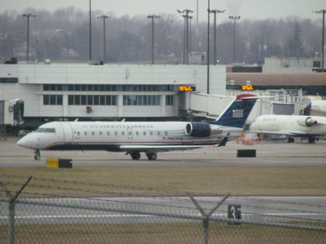 Canadair Regional Jet CRJ-200 (N463AW) - He had to wait there for a half an hour to takeoff... i would hate to be on the flight!