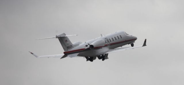 Learjet 45 (N60PL) - Wheels up on an overcast day