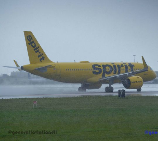 Airbus A320 (N938NK) - Heavy rain pour photograph of Spirit flight on south runway 10R.  Viewed from aircraft observation park at, 1800 SW 39th St, Fort Lauderdale, FL 33315