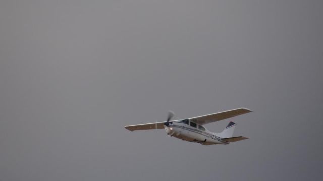 Cessna Centurion (N23HB) - N23HB doing touch and go's at Sugarland Regional Airport shot with my Sony Cybershot DSC HX100V