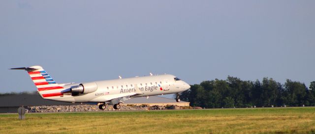 Canadair Regional Jet CRJ-200 (N261PS) - Inches away from main gear touchdown!