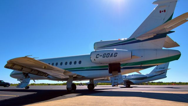 Dassault Falcon 900 (C-GOAG) - A rare sight to see two Canadian biz-jets on ramp at Stinson.