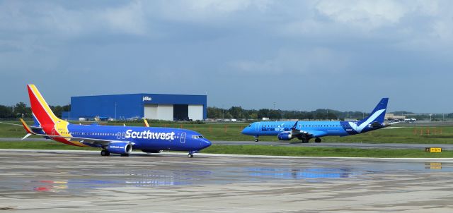 Boeing 737-800 (N8661A) - 9/23/22 SWA taxiing in to Airside, Breeze E175 N190BZ taxis in from Rwy 35R