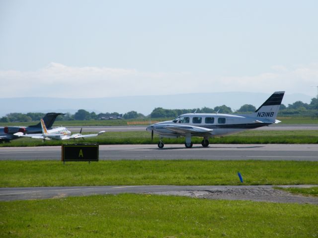 Piper Navajo (N31NB) - N31NB TAXING IN TO PARKING AREA AT MANCEHSTER AIRPORT UK ON   14-05-2008  N31NB PIPER PA 31 NAVAJHO  CN 31-7401239