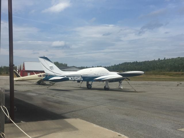 Cessna 310 (N310HD) - This Cessna twin-engine has been sitting at Berlin Airport for a week now. The other aircraft behind it left later in the day.