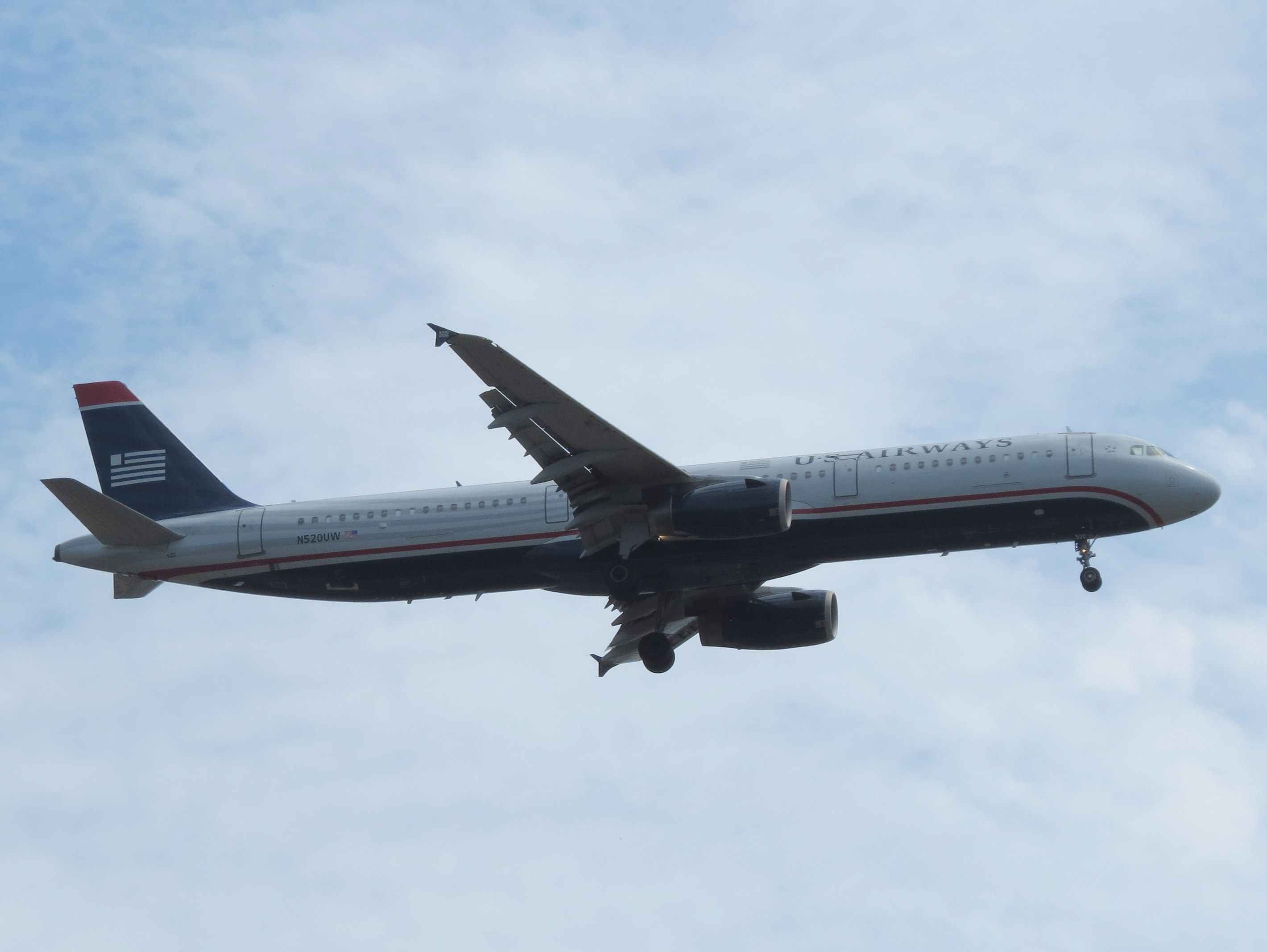 Airbus A321 (N520UW) - On final approach to SAN, seen over Balboa Park.