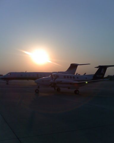 Beechcraft Super King Air 200 (N511DP) - BE-20 next to a GLF5