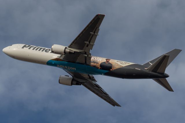 BOEING 767-300 (N1049A) - Air Transport 3372 departs runway 27 for Seattle (SEA). This aircraft was painted to promote the Amazon "Tom Clancy's Jack Ryan" TV series.