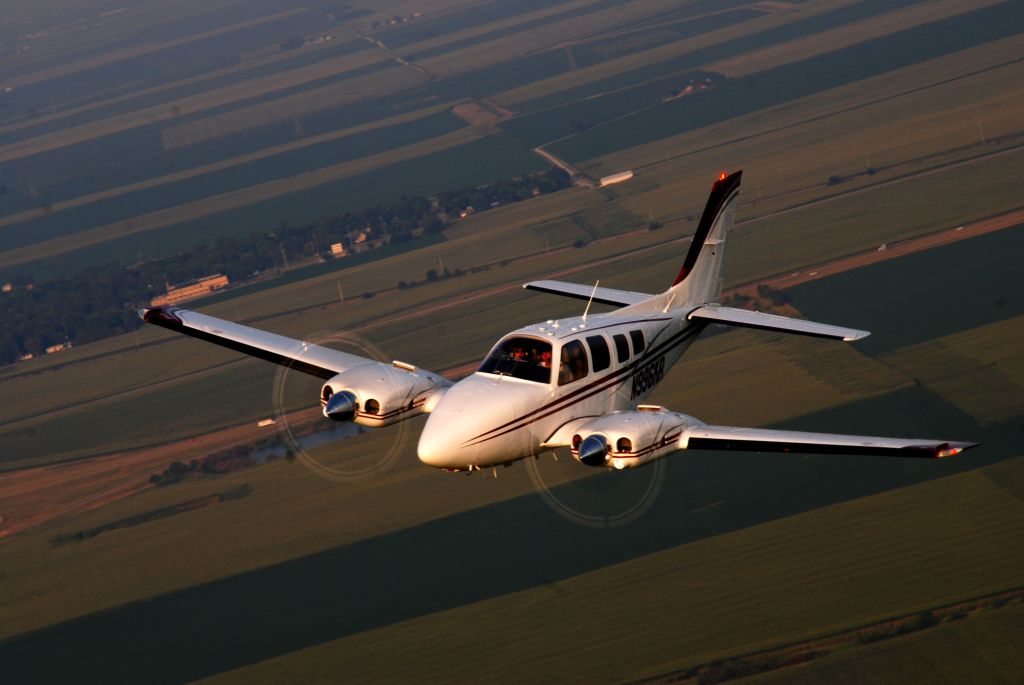 Beechcraft Baron (58) (N996KR) - Just before dusk in central Illinois.  Taken from N929DV, a friends Beech 18.