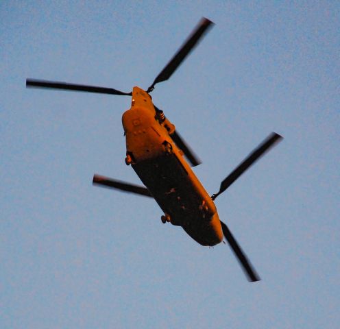 — — - Chinook helicopter flying over Simpsonville just before sunset.