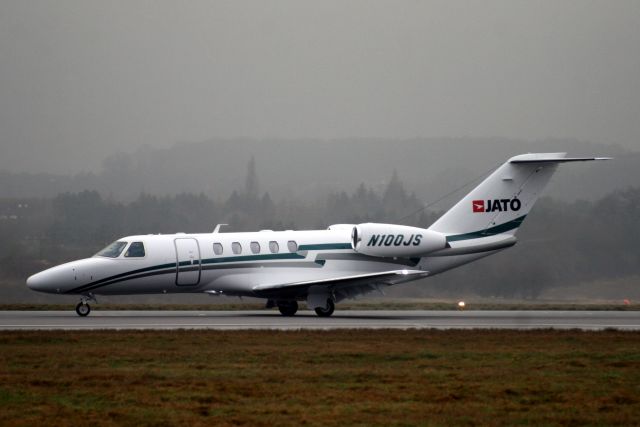 Cessna Citation CJ4 (N100JS) - Departing R26 on 11-Feb-11 heading for LEBL.  The third CitationJet to wear this registration.