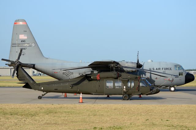 9126323 — - A Texas National Guard Blackhawk sits next to an Arkansas Air National Guard Hercules. July 2012
