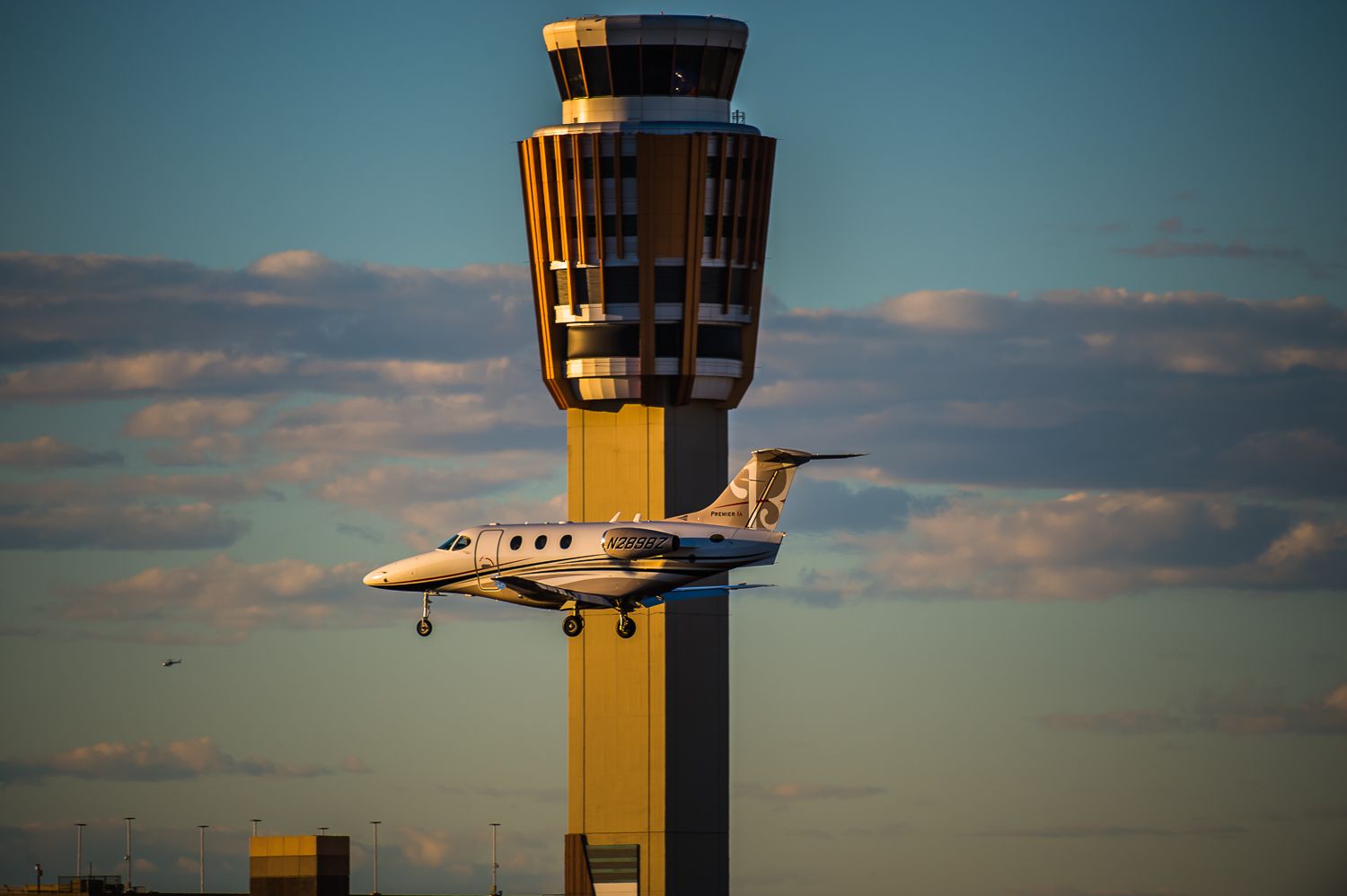 Beechcraft Premier 1 (N289BZ) - Shot from The Knoll at 40th Street at Phoenixs Sky Harbor International Airport, this beautiful Premier descends into Runway 25L. The tower was lit perfectly, and the sky couldnt have been any better.©Bo Ryan Photography | a rel=nofollow href=http://www.facebook.com/BoRyanPhotowww.facebook.com/BoRyanPhoto/a Please vote if you like the image!