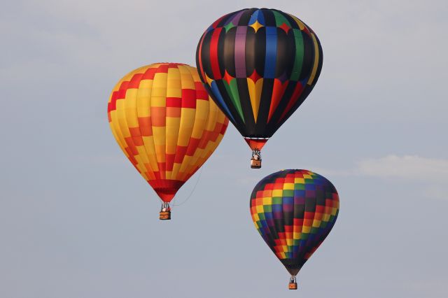 Unknown/Generic Balloon (N625DH) - Sunrise Fellowship, a Lindstrand 90A, at the left-center, with N51417 (Benevolence) and N157MC (Jabberwocky), as seen passing through Rossford, OH looking south from the Ohio Turnpike (near mile marker 65) on Sunday morning, 15 Jul 2018. A total of nineteen balloons competed in the 3rd annual Glass City Balloon Race in Rossford, OH.