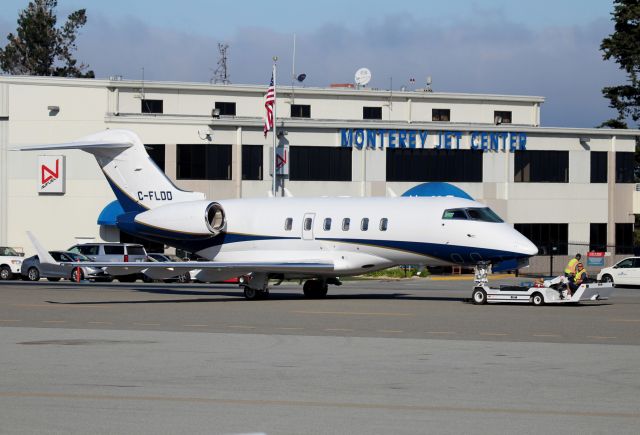 Bombardier Challenger 300 (C-FLDD) - KMRY - C-FLDD being towed out to the Monterey Jet Center ramp after ATT Pro Am Golf Tourney 2015 and readied for a flight to Canada.