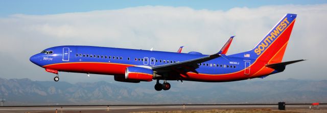 Boeing 737-800 (N8301J) - Landing on 16L.