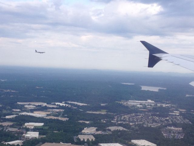 Airbus A321 (N172US) - A US Airways Airbus a321 N172US on approch to Charlotte Douglas International Airport (KCLT) from Philadelphia International Airport on July 16, 2014. If you look in the background you can see another US Airways plane on approch to CLT Airport.