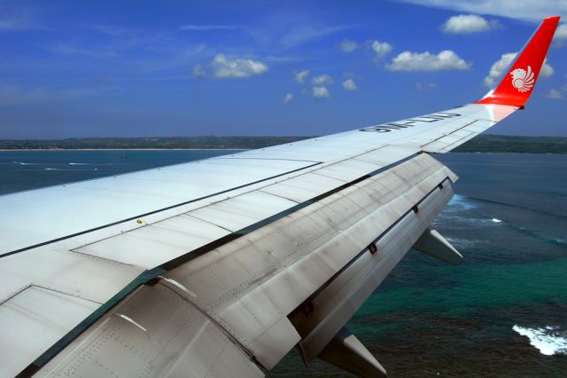 Boeing 737-900 (9M-LNJ) - Just about to touch down on the magical island of Bali after the flight from Kuala Lumpur.  28th March, 2014