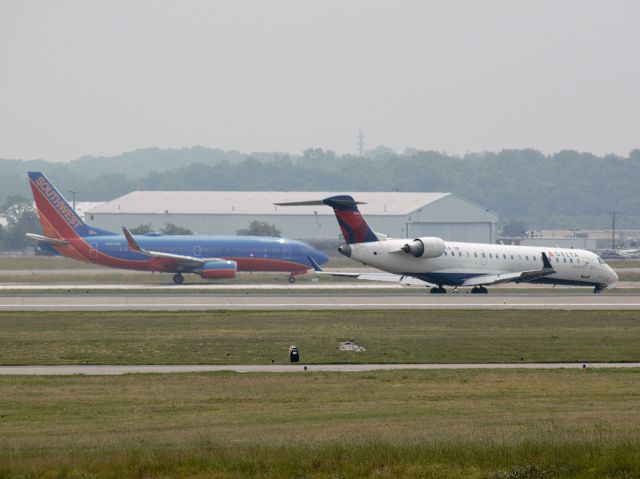 Canadair Regional Jet CRJ-700 (N656CA) - N656CA and W920WN 20R and 20C on 5/19/2013