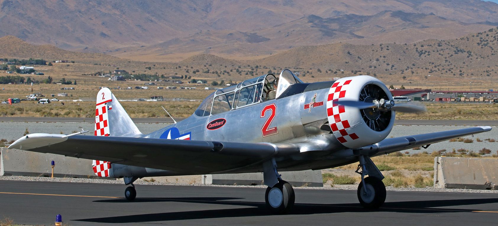 North American T-6 Texan (N1465) - Twelve more days of waiting and then the 2017 National Championship Air Races (aka: Reno Air Races) get underway.  "Bare Essentials" (N1465, a Harvard MK-IV), seen in this pic taken at last years races being taxied back to the pits by Ralph Rina after completing a qualifying race, will be back on the race course again this year.  Chris LeFave is listed as this years "Base Essentials" pilot.