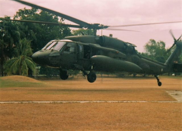 — — - 05/90 Blackhawk with extended range tanks, lift off from our headquarters, Ft Amador, Panama