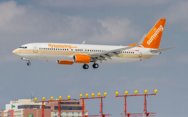 Boeing 737-800 (C-FTLK) - Short finals for runway 24R at YYZ. Leased equipment for Sunwing for the winter season