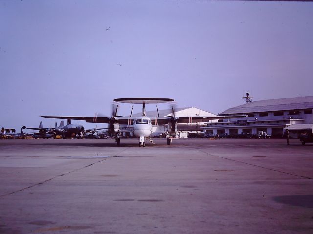 — — - TAN SON NHUT AIR BASE, SAIGON, VIETNAM 1966 – ON THE FLIGHT LINE A NAVY E-2 HAWKEYE PARKING AND A LOCKHEED CONSTELLATION PARKED, MOST LIKELY USAF, BUT AFTER 50 YEARS I JUST DONT REMEMBER. 