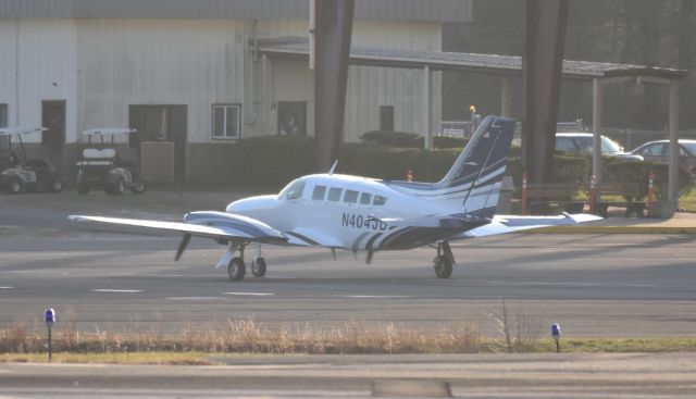 Cessna 402 (N404JD) - A Cessna 402 twin prop taxis into a parking area at Monmouth airport, NJ Dec. 2020.