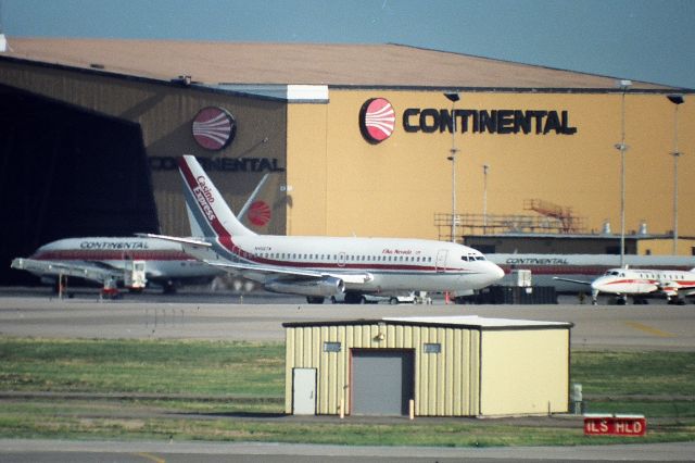 Boeing 737-200 (N456TM) - KDEN - Casino Express rolling through Stapleton...1000mm lens Celestron C-90 from the old photo platform area