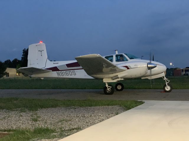 Beechcraft Twin Bonanza (N816DS) - On the taxiway.  