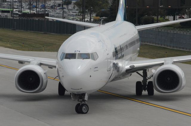 Boeing 737-900 (N274AK) - Alaska Airlines flight 718 is pulling into Gate A9 at 3:33 PM CDT.  This flight was flown on what was then Alaskas newest aircraft.  Photo taken July 28, 2017 with Nikon D3200 mounting 55-200mm VR2 lens.