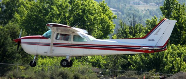 Cessna Skyhawk (N84DL) - Although it may look like the Cessna is in the wires, it is not. This plane is owned and operated by a flight training center.