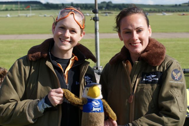 — — - The Brietling Wingwalker ladies with "Douglas" the FlyDC3 NZ mascot @ Flying Legends airshow,Duxford 01 July 12