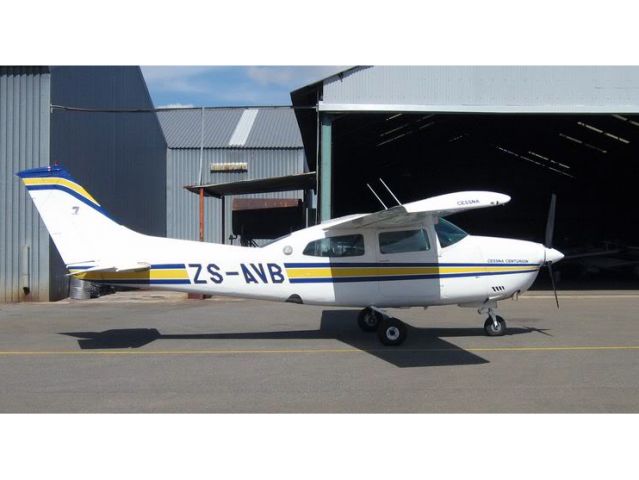 Cessna Centurion (ZS-AVB) - AVB in front of her old hangar. Currently the hangars at FAGC are under construction.