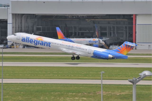 McDonnell Douglas MD-80 (N872GA) - A three fer. Three Allegiant birds in this shot, a 757 in the hanger, an A320 on the ramp, and the mad-dog blasting off.