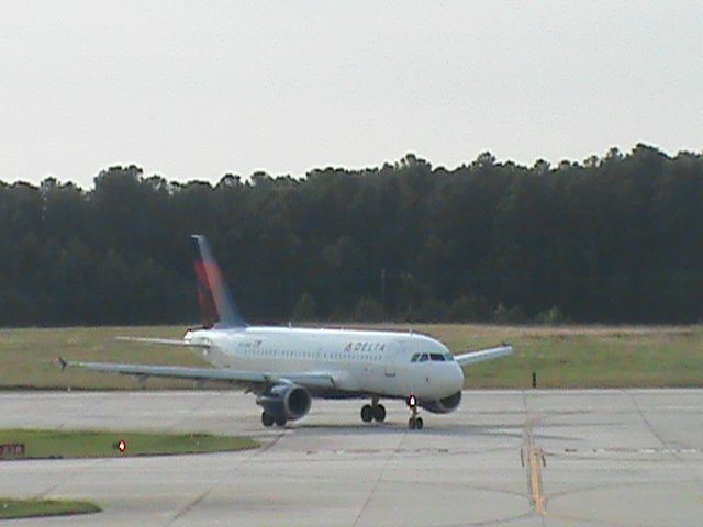 Airbus A319 (N319NB) - Delta Flight 584 From KMSP is taxiing down the road after landing 5L at KRDU. Taken 6/20/2013.