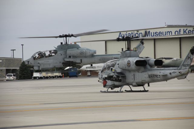 — — - Two Bell AH-1 SuperCobras from USMC HMA 269, "Lawman 6" and his partner preparing for takeoff.