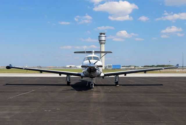 Pilatus PC-12 (N554NG) - N554NG, c/n 1554, parked on the Atlantic Aviation ramp with the Air Traffic Control Tower in the background, in Cleveland, OH on 20 Aug 2017.