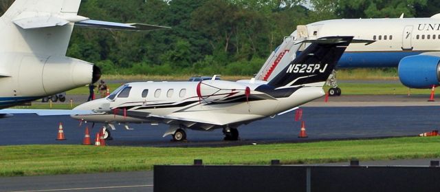 Cessna Citation CJ1 (N525PJ) - MORRISTOWN, NEW JERSEY, USA-AUGUST 02, 2019: Seen on the ground at the airport was this Cessna Citation. Behind it is Air Force One.