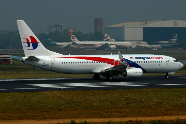 Boeing 737-800 (9M-MLI) - Notice the "One World" sticker