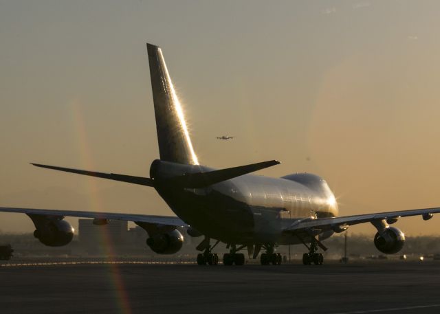 Boeing 747-400 (N415NC) - Heading into the early morning sun - this Atlas Cargo B747 is moving down taxiway Alpha for the freight area at LAX, Los Angeles, California USA