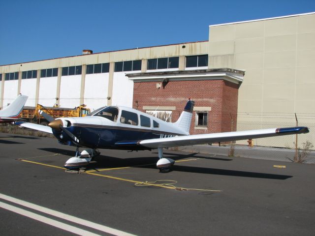 Piper Cherokee (N4481F) - at Queen City    that boring building in the background is now the Allentown City maintenance garage (note the truck).  During World War II, this was the hangar where the Vultee TBY-1 Sea Wolf was built.  There had been a tower at this corner of the hangar.