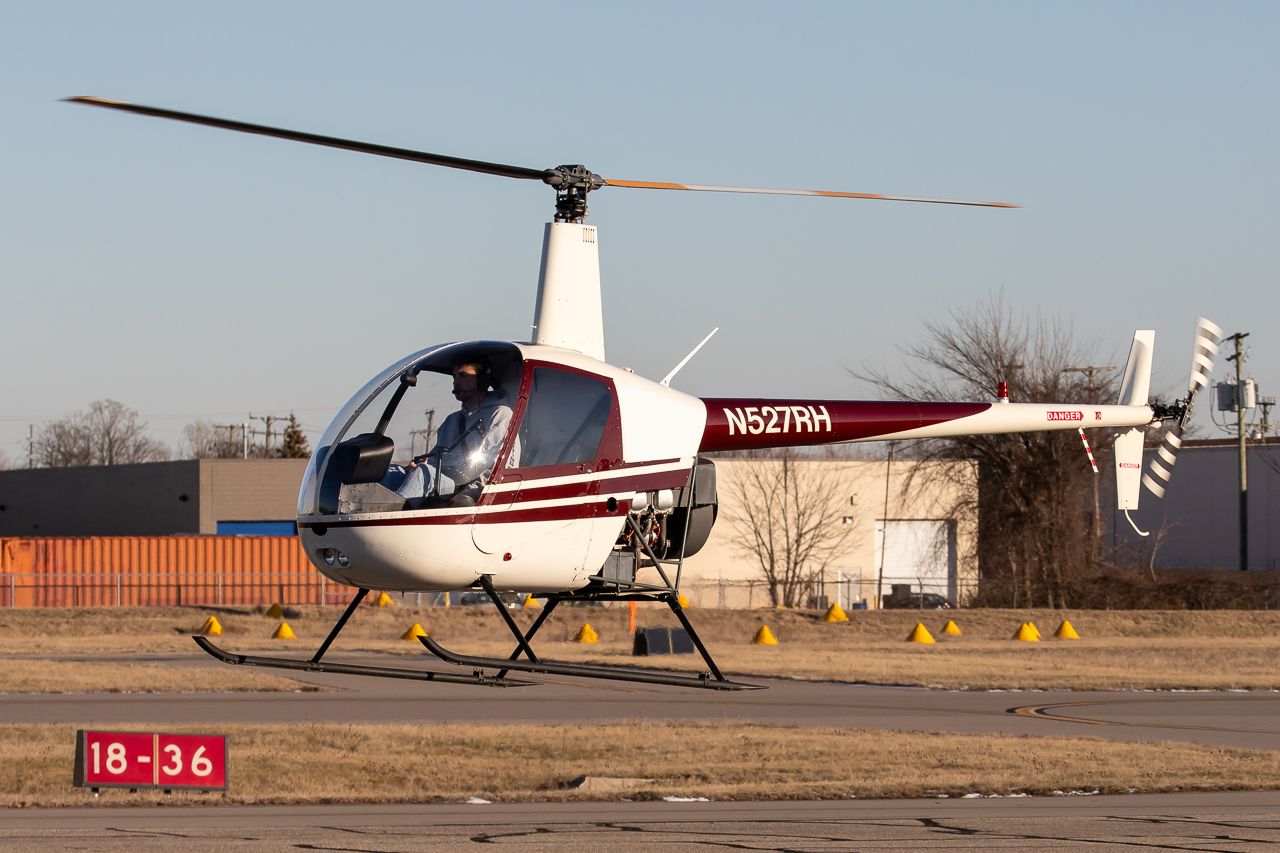 Robinson R-22 (N527RH) - Robinson R22 about to land on the ramp to get some gas before heading back to the hangars