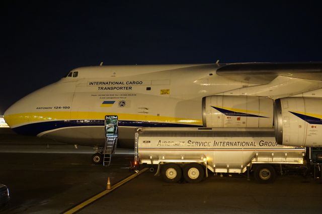 Antonov An-12 (UR-82029) - One of the biggest fuel trucks in the world is dwarfed by the massive Antonov. 