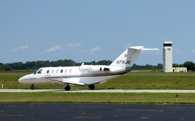 Cessna Citation CJ2+ (N716JS) - Shown here taxiing with the Tower in the background is a Citation CJ2 in the Summer of 2017.
