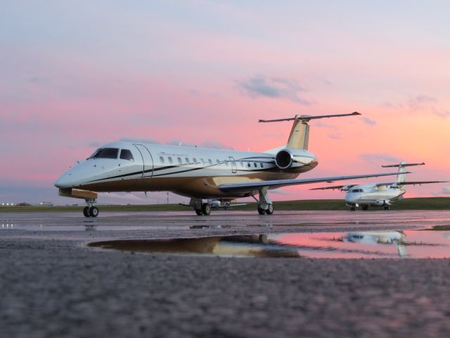 Embraer ERJ-135 (UJC56) - Ultimate Airs newest addition basks in a beautiful sunset here at KCAK. 